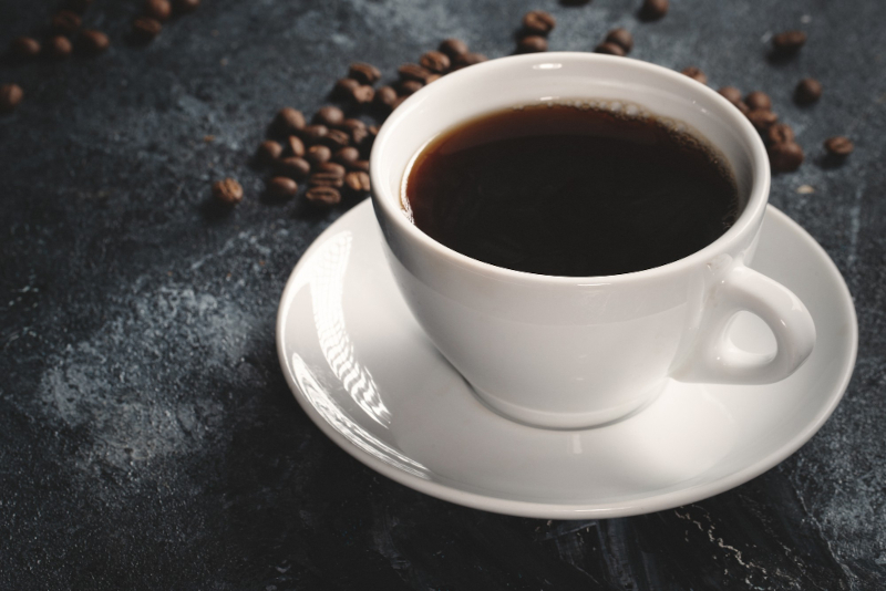 Black coffee closeup - coffee can fit into your healthy lifestyle and is part of a healthy breakfast routine.